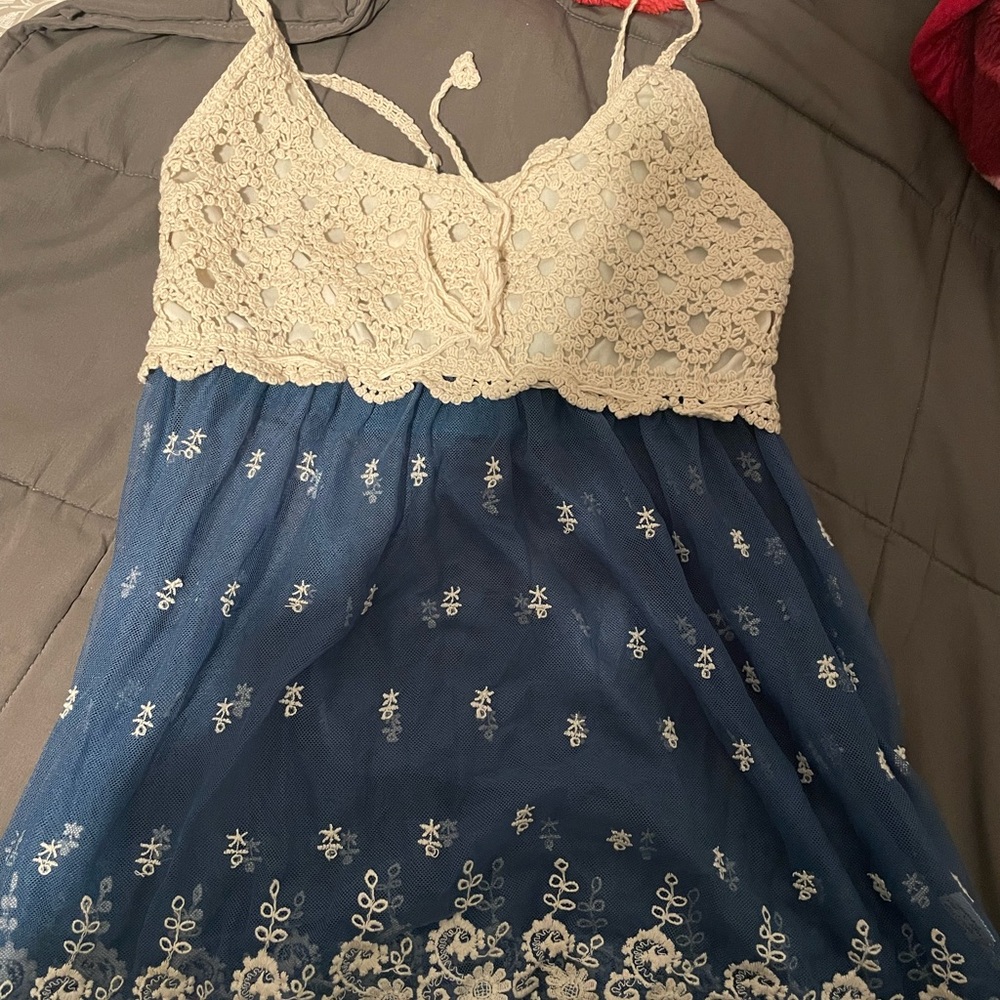 A blue and cream strap shirt. Supper cute